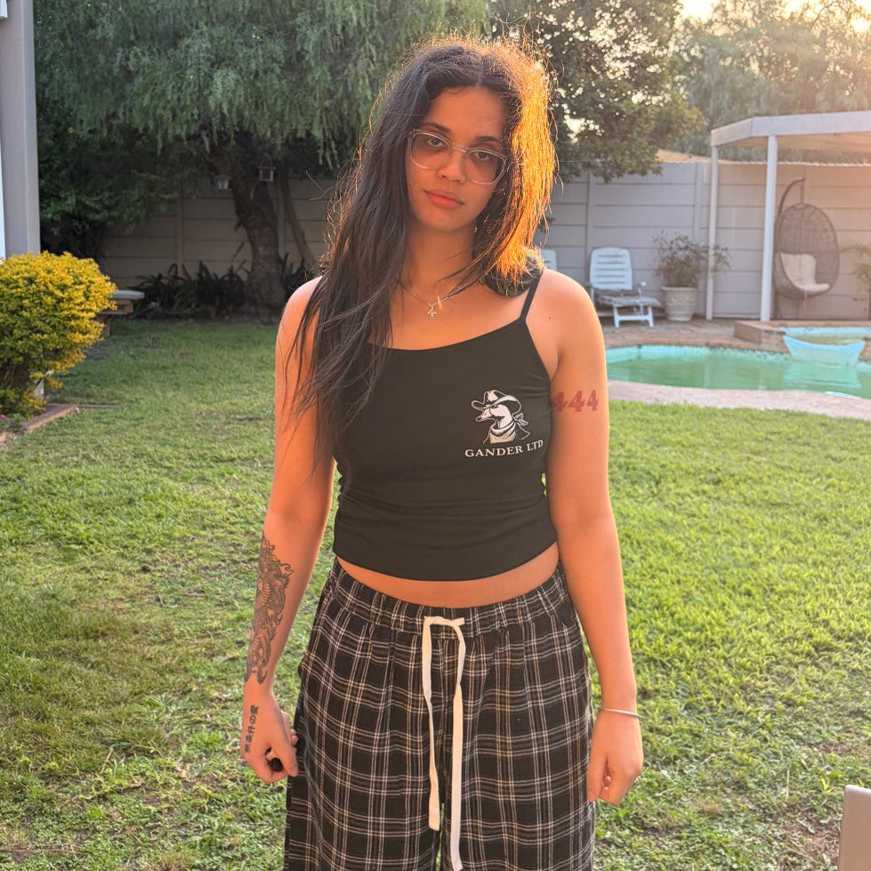 Women’s black Gander strappy top worn in the original editorial