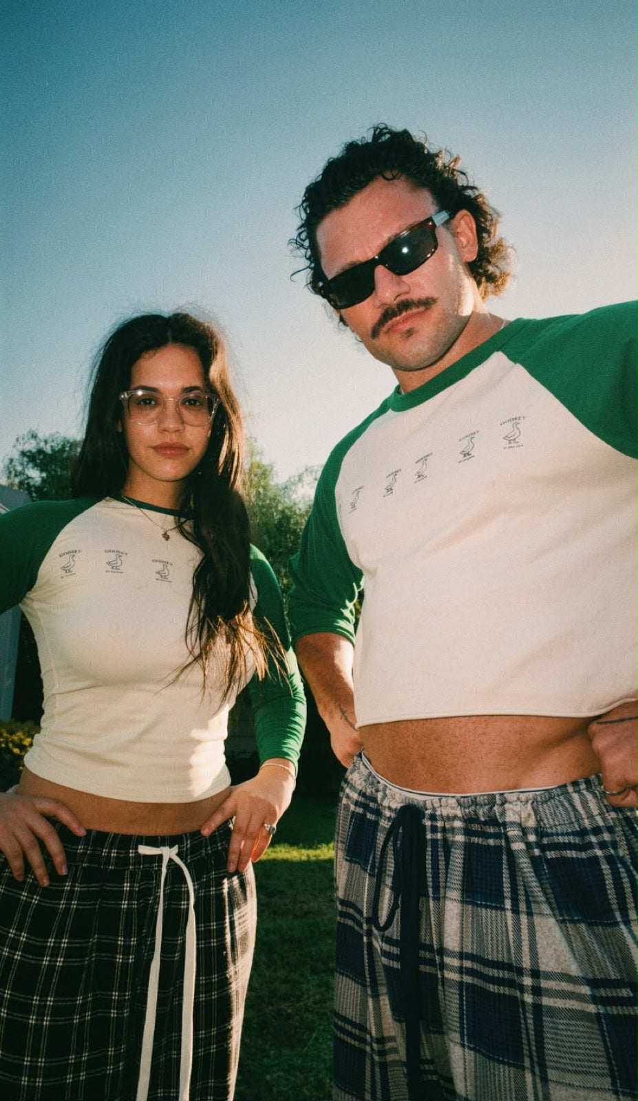 Women’s fitted green Goosey baseball tee in the original editorial